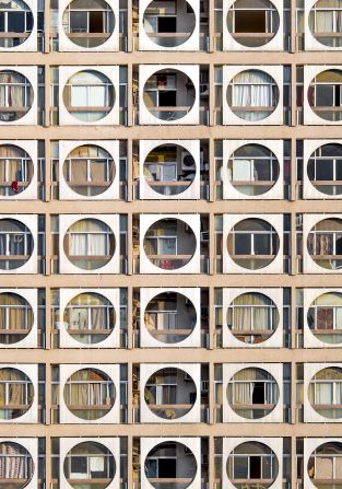 Abu Dhabi-based photographer Hussain AlMoosawi is documenting the architecture of the United Arab Emirates to understand its rapidly evolving urban landscape. Born in 1984, he found himself drawn to early modern architecture, like the Obeid Al Mazrouei building in Abu Dhabi (pictured). Also known as the “Connect Four” building, this 10-story residential building from the 1980s has a striking facade of circle frames, offering shade and privacy to the terraces behind. <strong>Look through the gallery to see more distinctive architecture from Abu Dhabi and the Emirates.</strong>