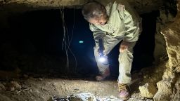 Bone hunter Takamatsu Gushiken looks for World War II-era remains in a cave on Okinawa.