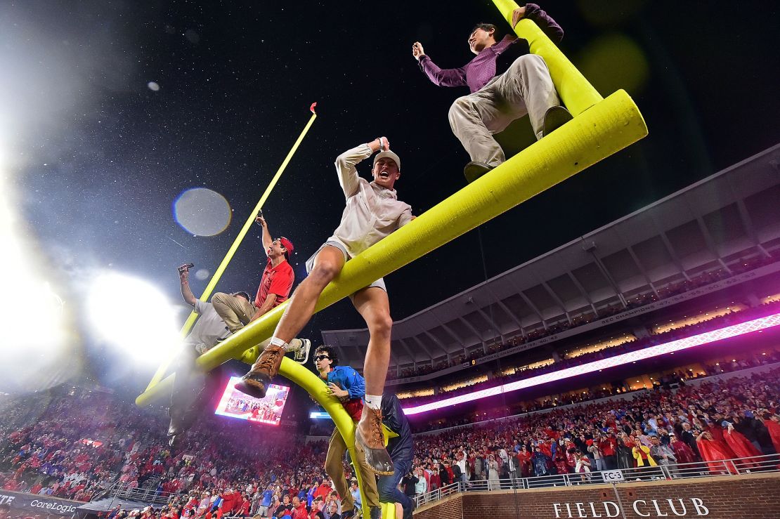 Fans sit atop the field goal after Ole Miss' 28-10 victory over the Georgia Bulldogs at Vaught-Hemingway Stadium on November 09, 2024.