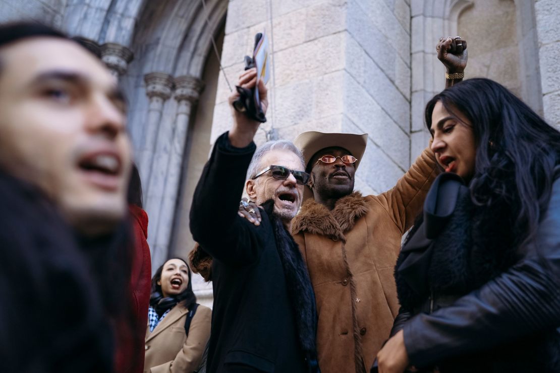 Yves Mathieu-East, right, joins the crowd in chanting "Cecilia!" after her funeral.