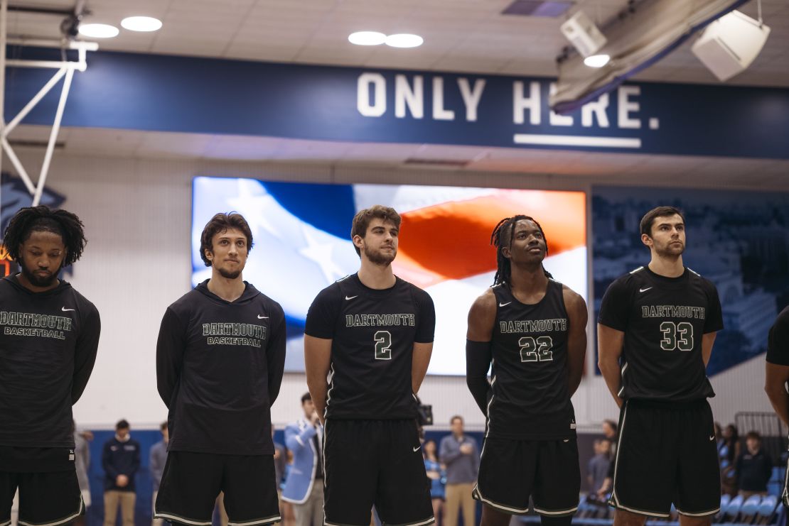 Romeo Myrthil, second from left, and Cade Haskins, third from left, stand with fellow Dartmouth teammates during the game against Columbia University.