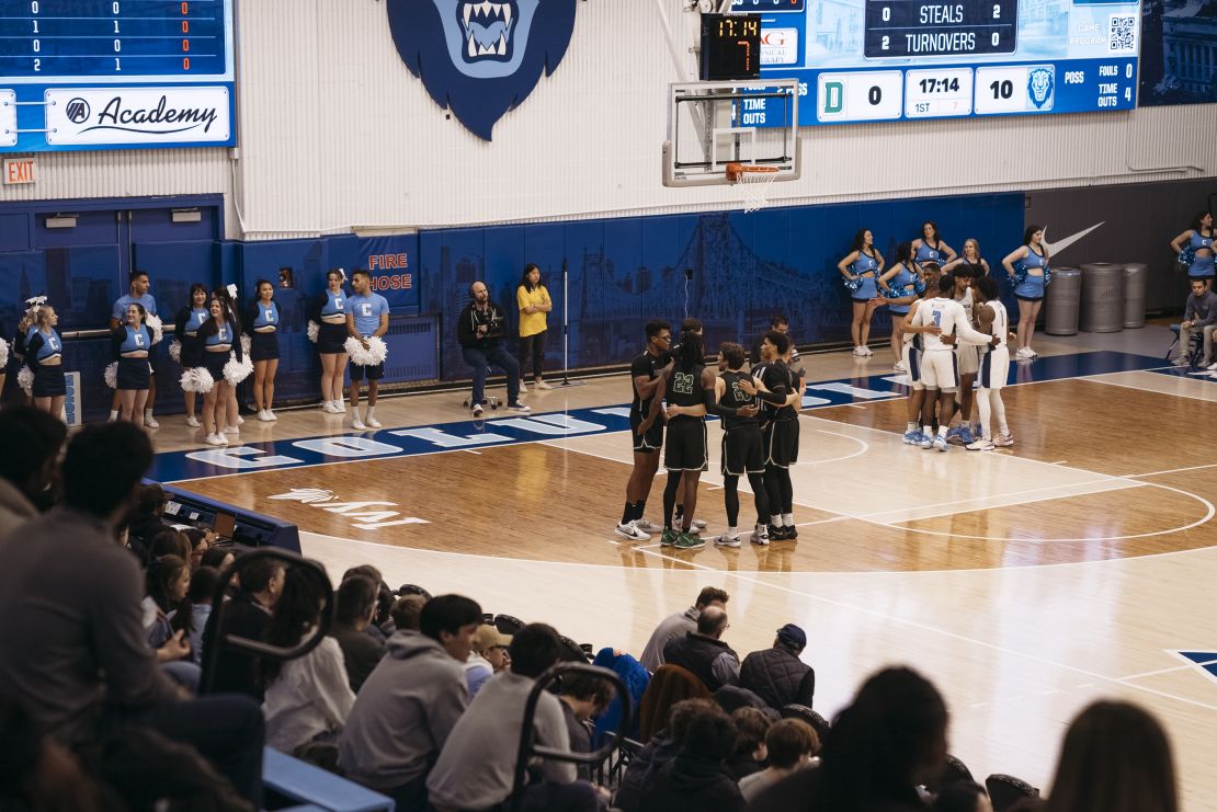 Teams huddle during the basketball game on February 16.