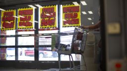 People leave with their items at the last Kmart that is now closing this weekend in Bridgehampton, New York, on October 16.