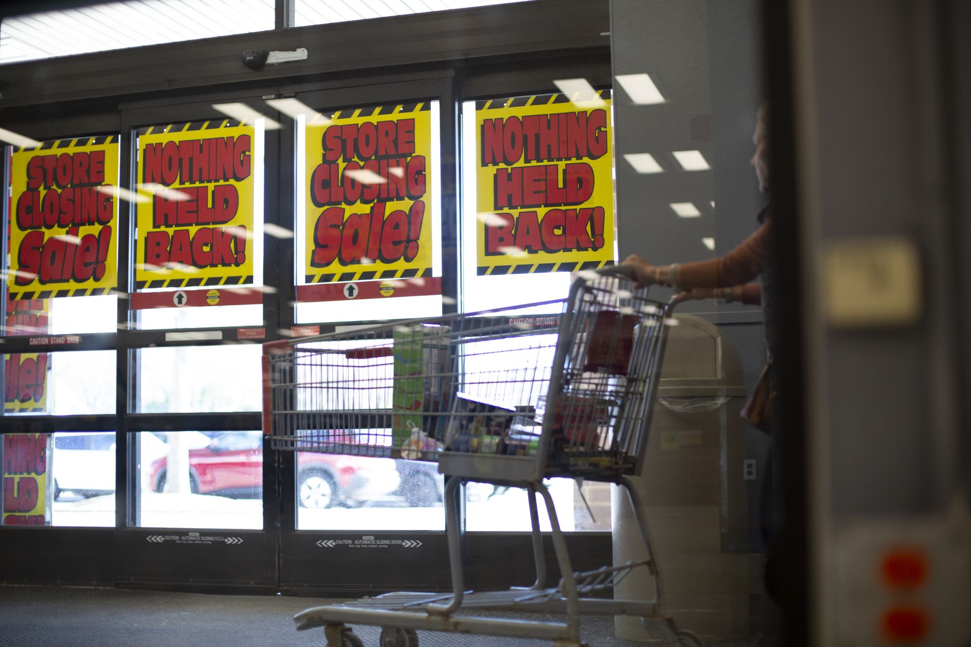 People leave with their items at the last Kmart in Bridgehampton, New York, on October 16. The store, the last full-size Kmart in the mainland United States, is closing for good on Sunday.