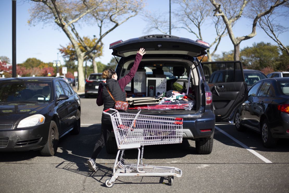 Jessica Cohan fills her car with her purchases at the Bridgehampton Kmart's going out of business sale.