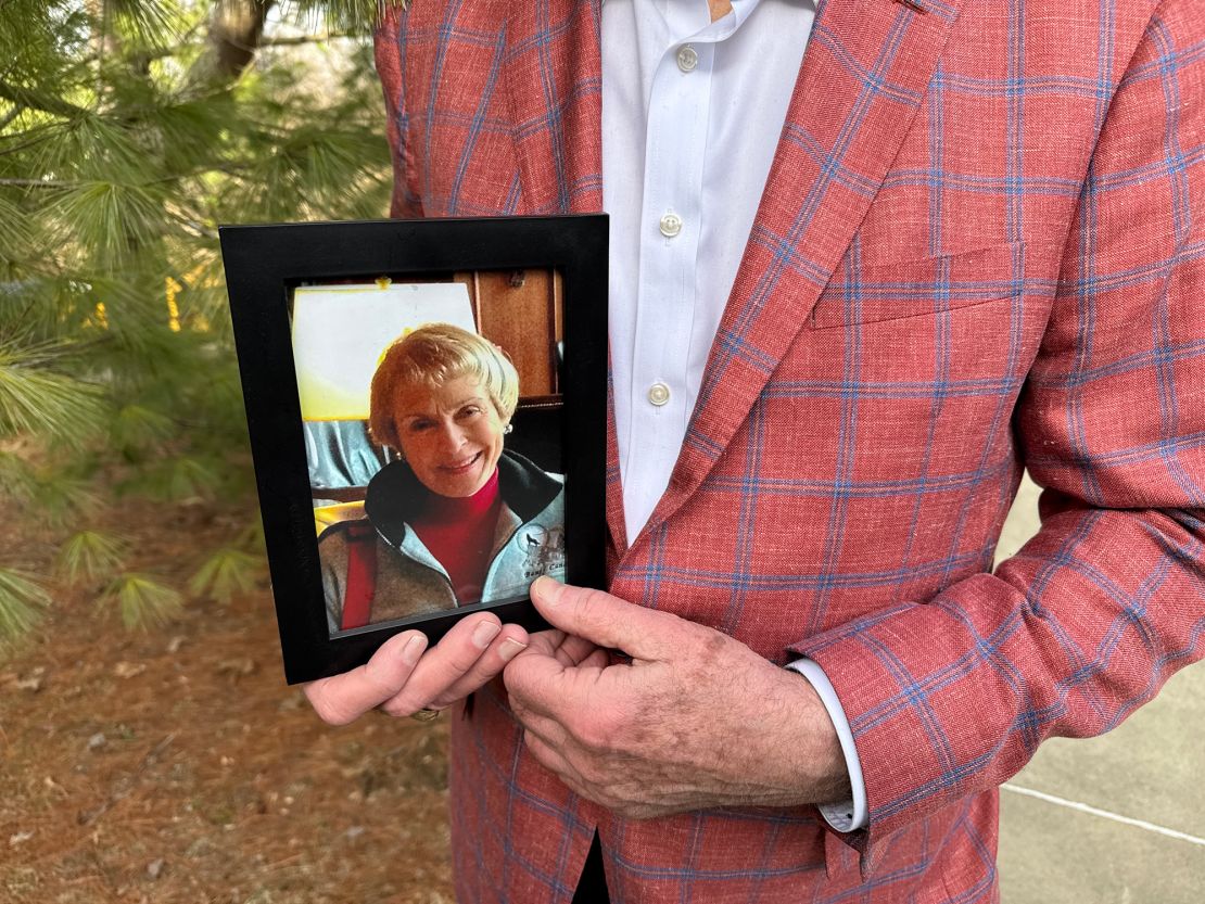 Yarber holds a photo of Margaret Covher, his wife of 12 years. Even though they had divorced by the time of her stroke in 2017, he became her caretaker, and they remained involved until her death in 2021.