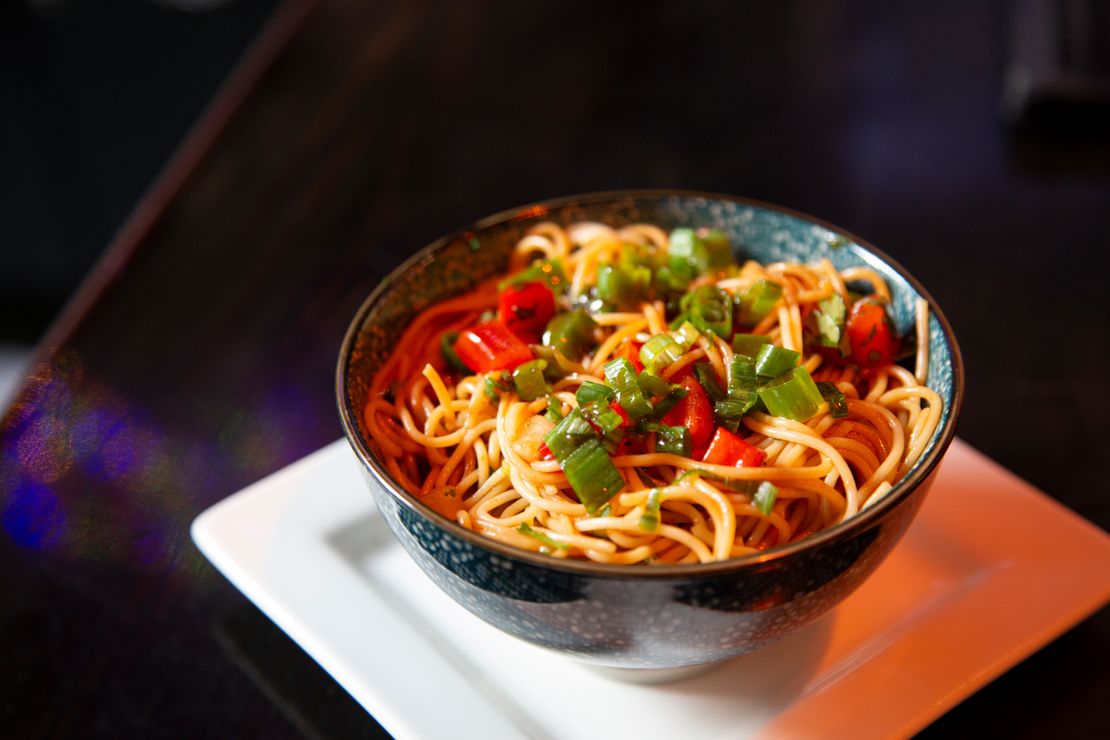 Sesame noodles served at Misuta Chow’s. Faux roofs and real lanterns inside give the place the feel of a Tokyo alleyway.