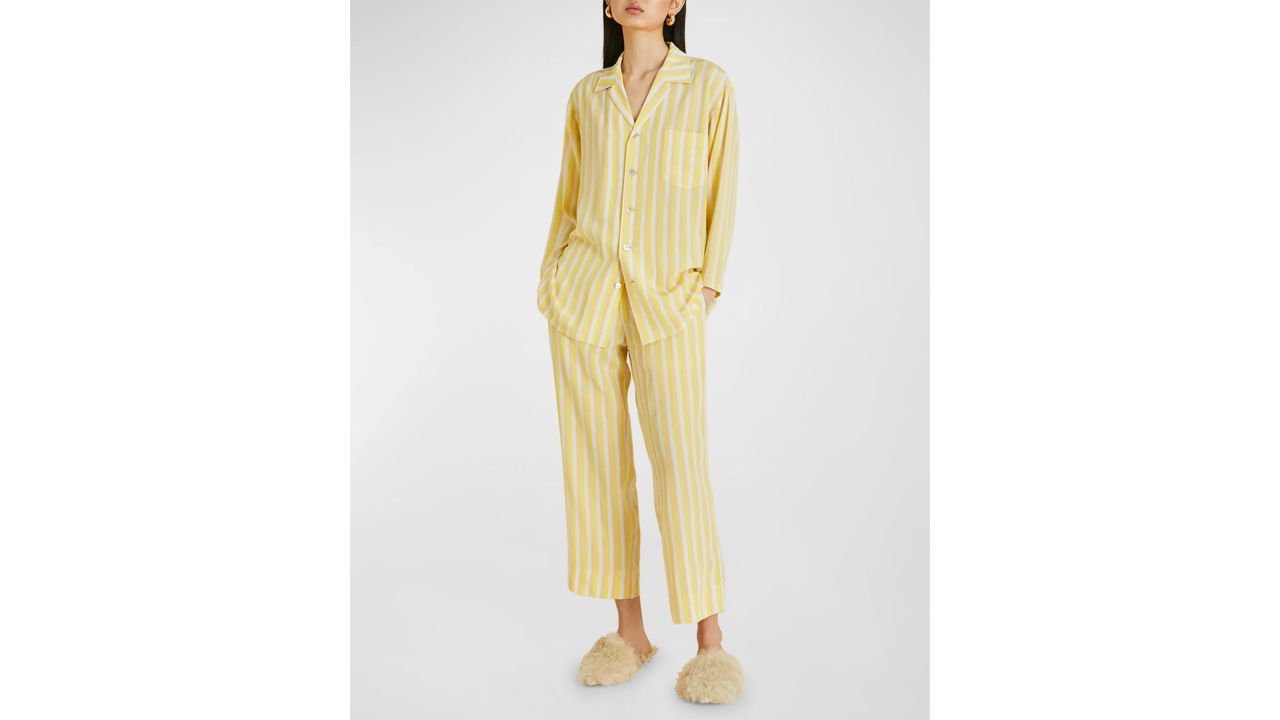 Woman wearing yellow striped Olivia Von Halle pajamas