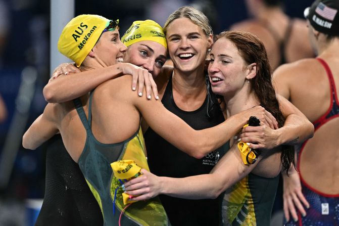 Australia's Emma McKeon, Meg Harris, Shayna Jack and Mollie O'Callaghan celebrate after winning the women's 4x100-meter freestyle relay on July 27. The team <a >set an Olympic record</a> with a time of 3:28:92.