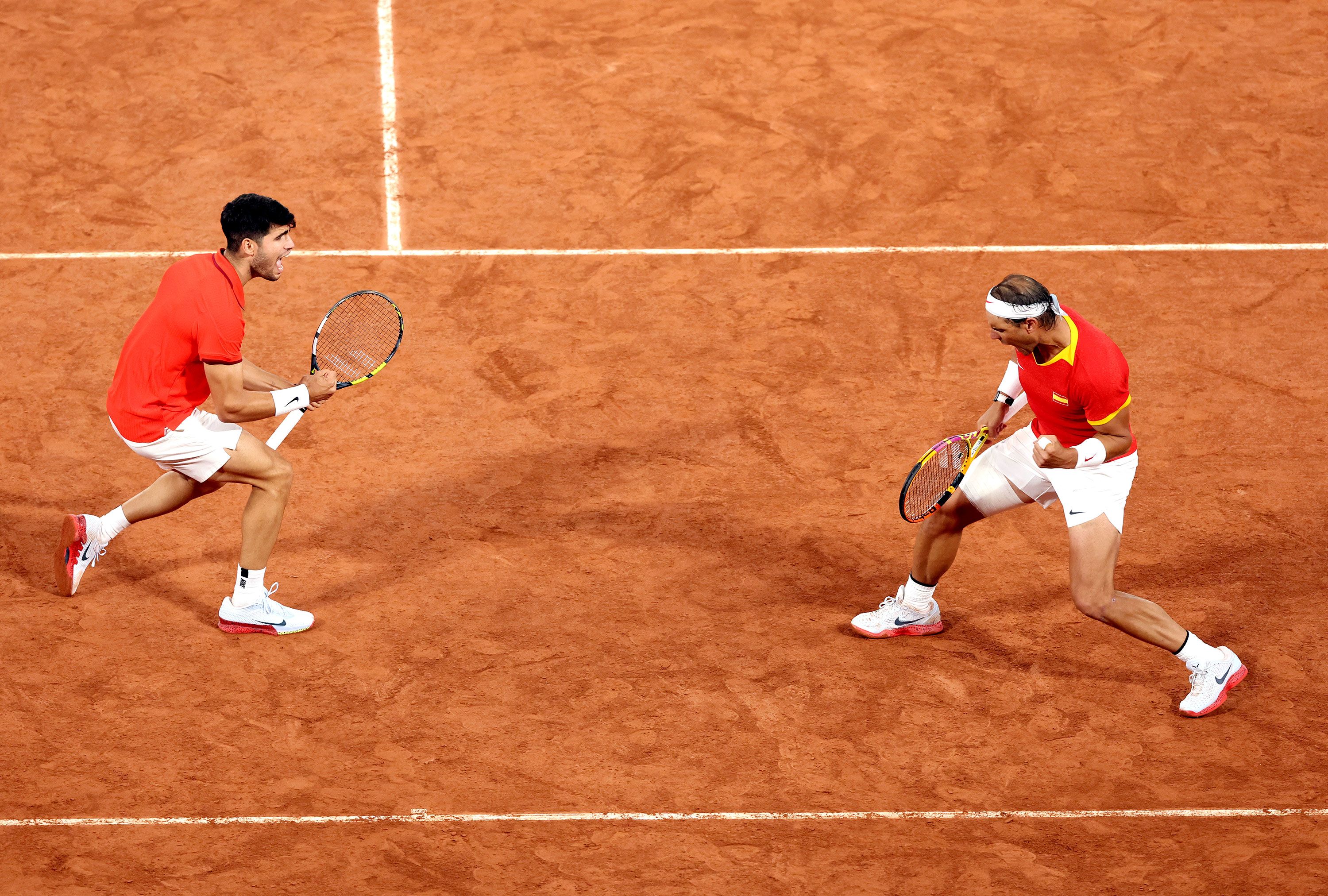 Spanish tennis players Carlos Alcaraz and Rafael Nadal celebrate during a doubles match on July 27. <a href="https://www.cnn.com/2024/07/27/sport/rafael-nadal-carlos-alcaraz-paris-olympics-tennis-spt-intl/index.html">The dream pairing</a> beat Argentina’s Máximo González and Andrés Molteni 7-6, 6-4.