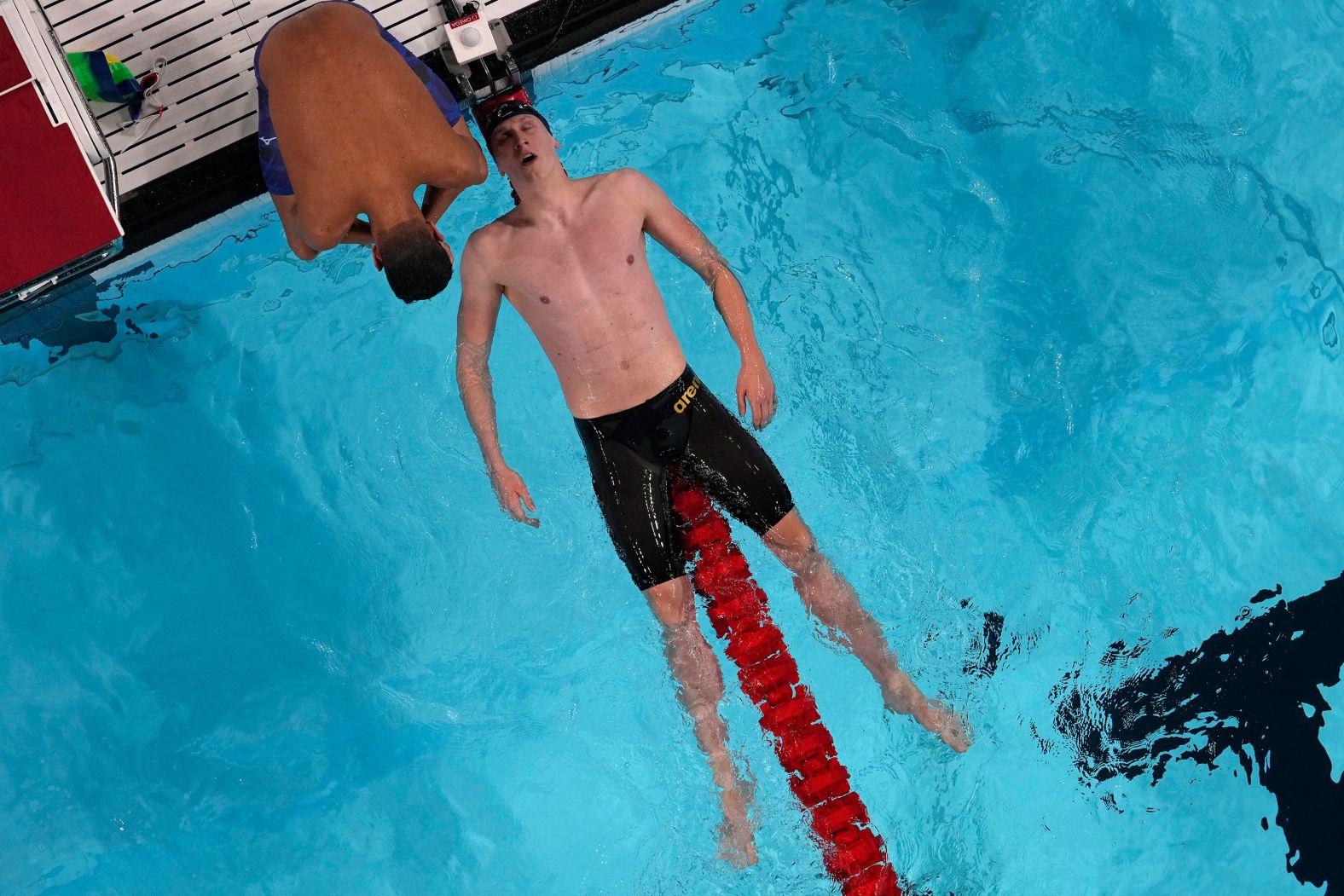 Germany's Lukas Maertens falls back on a lane rope after <a >winning the 400-meter freestyle</a> on July 27.