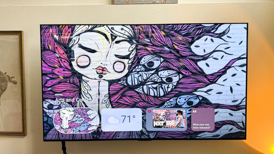 A graffiti image with weather forecast and other widgets is shown as the Onn 4K Pro screensaver on a TV