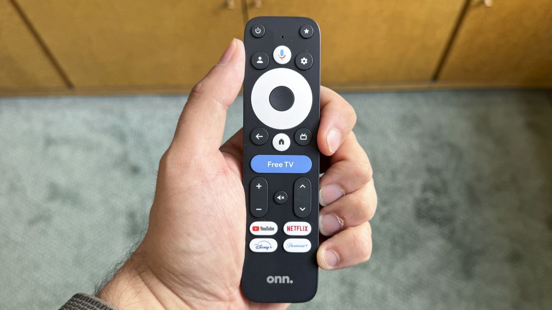 The Onn 4K Pro's remote, which has a "Free TV" button among others, in hand