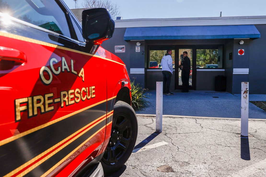 Ocala Fire Rescue Capt. Jesse Blaire, right, speaks with a man seeking treatment at Beacon Point, an integrated care center for treating people with substance use disorders in Ocala, Florida.