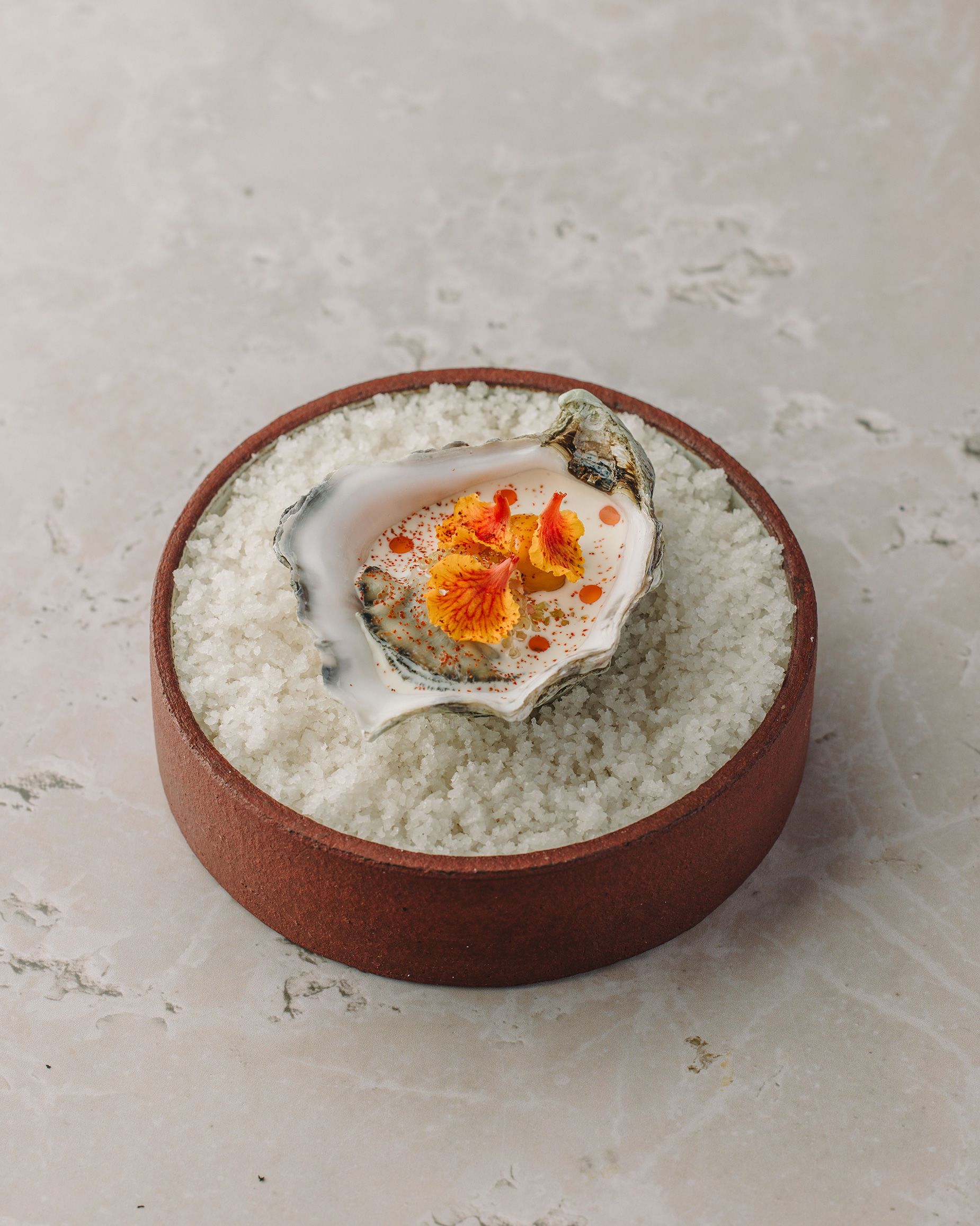 Oyster with smoked cream and nutty sea buckthorn oil.