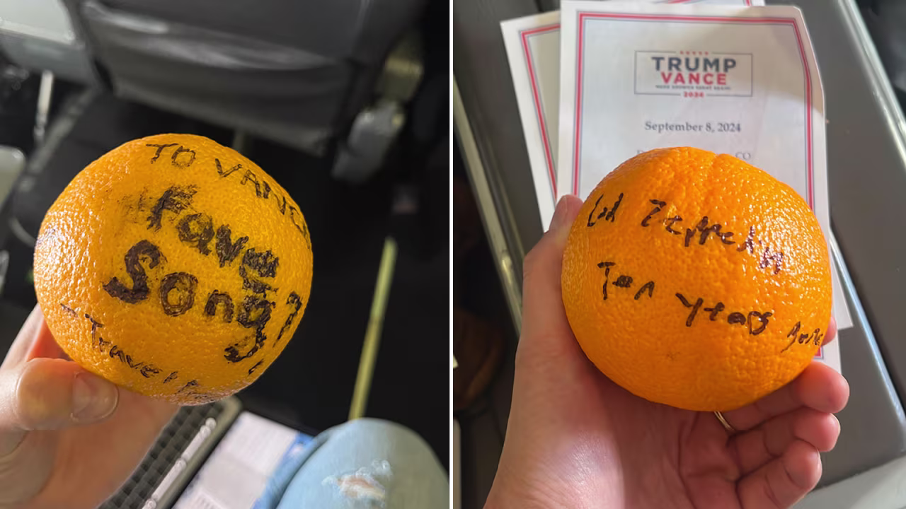 A question written on an orange was rolled to Sen. JD Vance on his campaign plane on Tuesday, Octoaber 8.