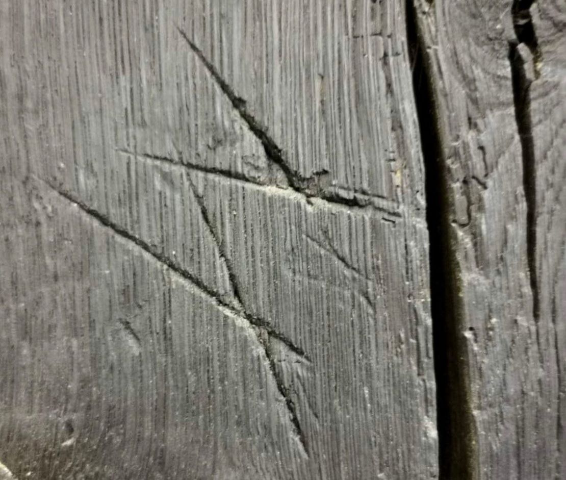 These apotropaic marks were discovered at a Tudor property, once visited by Henry VIII and his then Queen, Catherine Howard, and were meant to provide ritual protection.