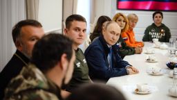 In this image released by the Kremlin, Russian President Vladimir Putin meets with representatives of volunteer organizations in the Kursk region of Russia.