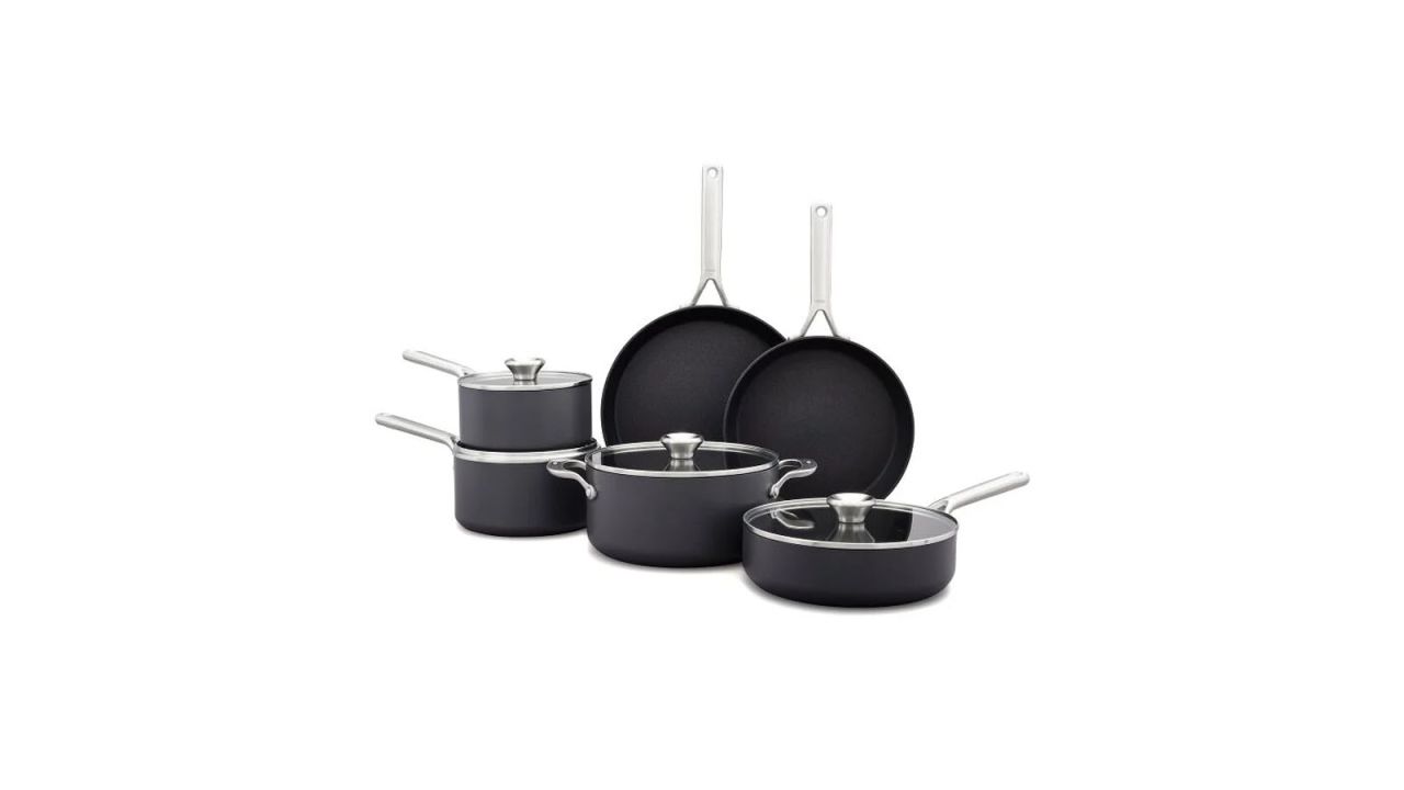 Six pots and pans part of cookware set.