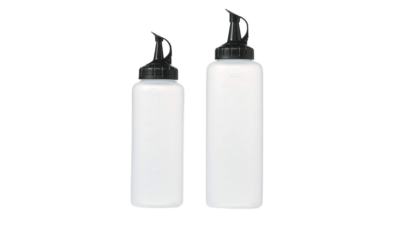 Two OXO Good Grips Chefs Squeeze Bottles against white background.