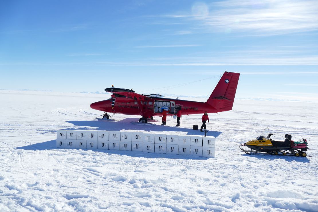 Insulated boxes full of ice cores being loaded into the Twin Otter aircraft, Skytrain Ice Rise, Antarctica.