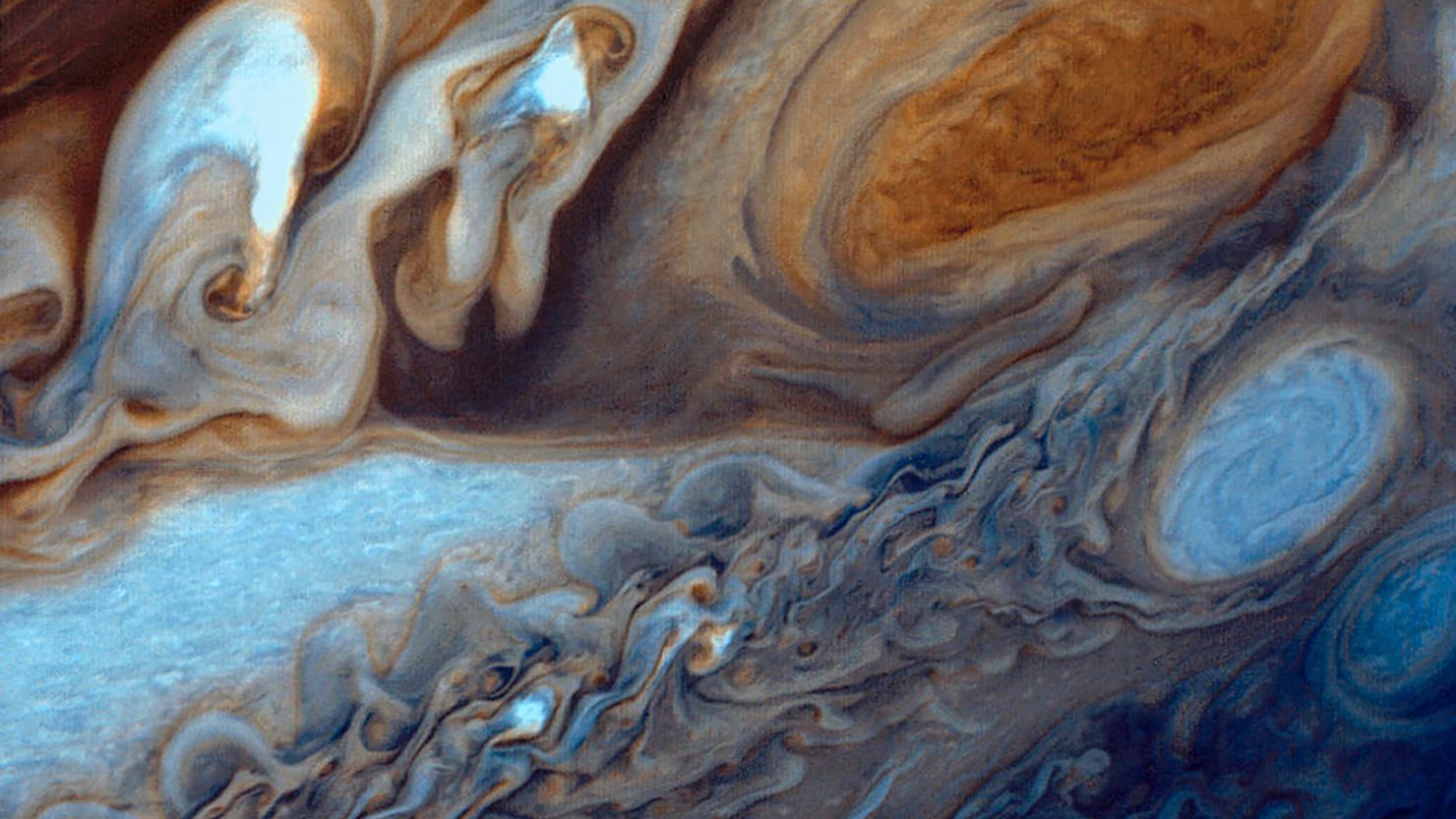 Jupiter's red spot, a massive storm system, is an example of turbulent flow.