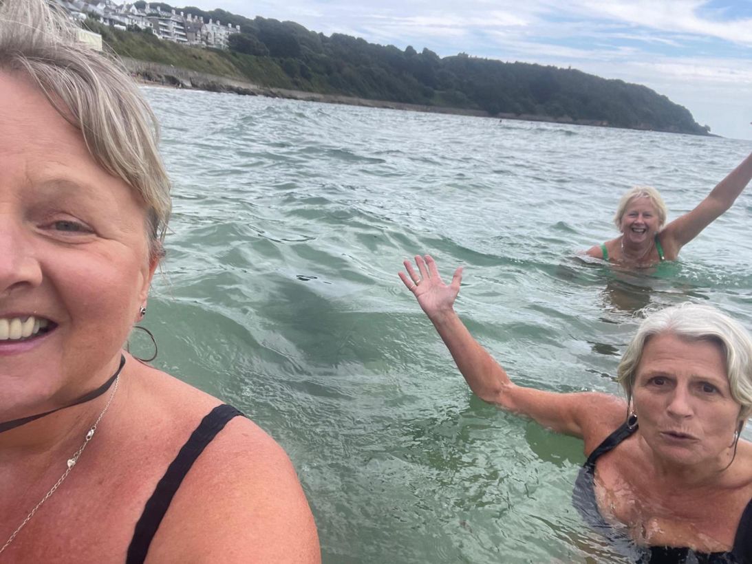 On their return trip to Castle Beach, the sisters prioritized a dip in the sea before taking the recreated photo.