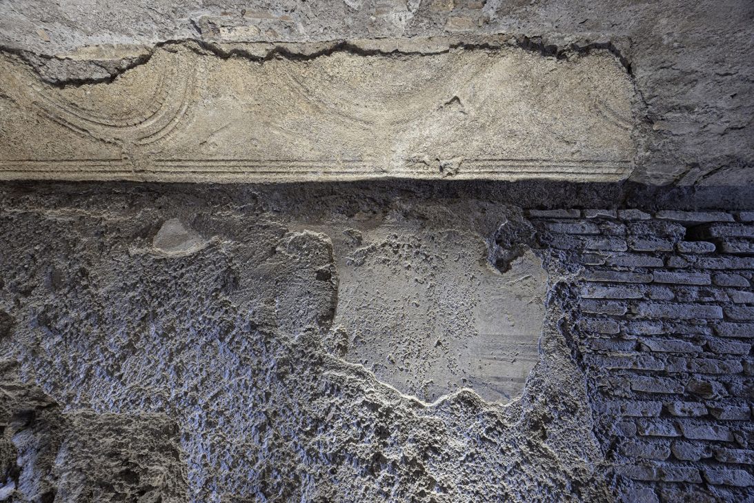 Wall decorations are visible inside the passage.