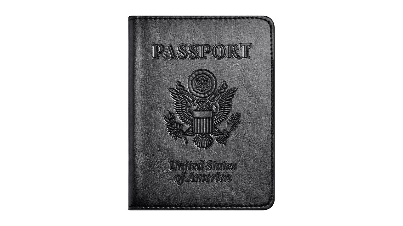 A photo of a black passport cover
