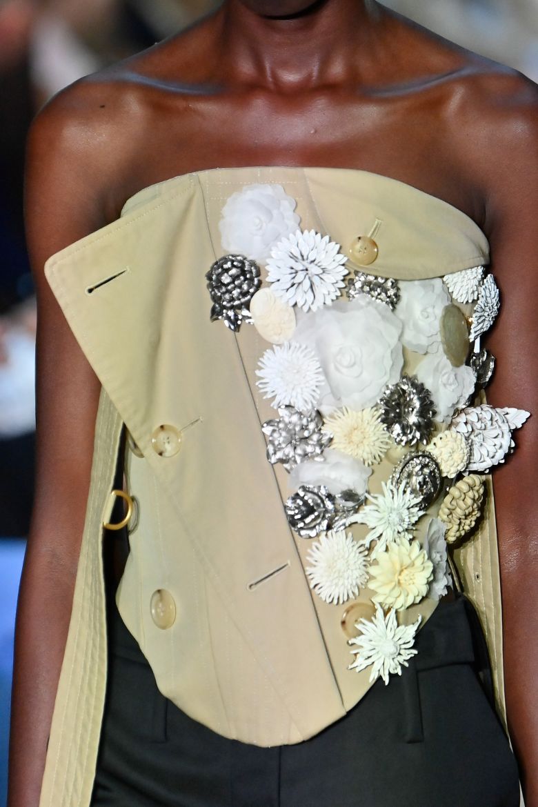The trench coat, a symbol of British heritage, was reinvented by Patrick McDowell into structured bustier tops and full skirts.