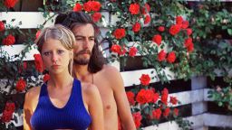 Pattie and George at their Surrey home Kinfauns The Rose Garden taken by Boyd (estimate 4,000-6,000).jpg