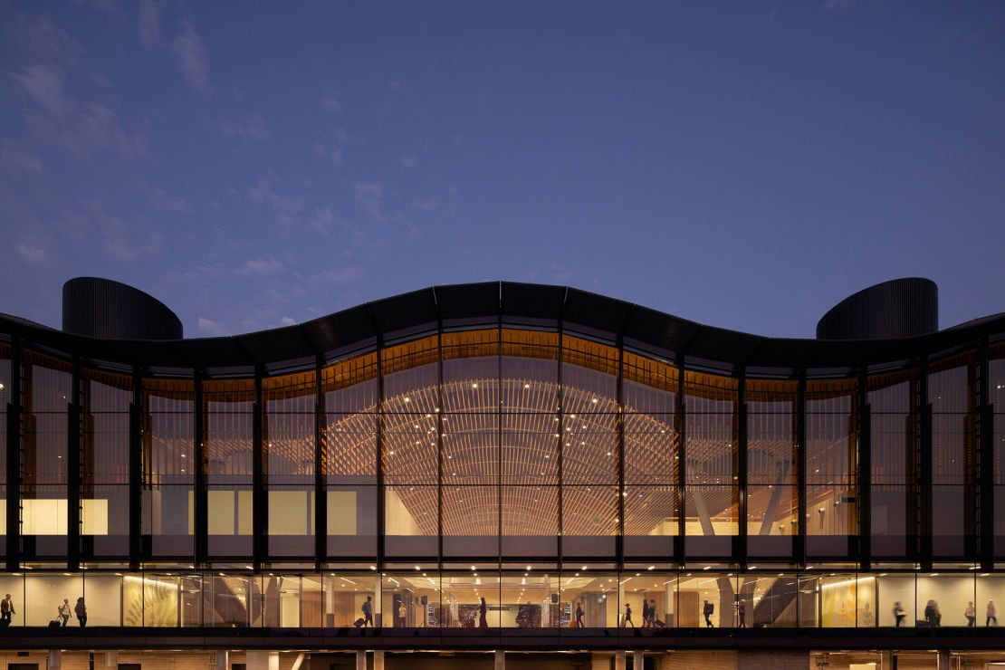 The undulating roofline and glass wall showing the interior wooden ceiling give the main terminal at PDX a different feeling from most other major US airports.