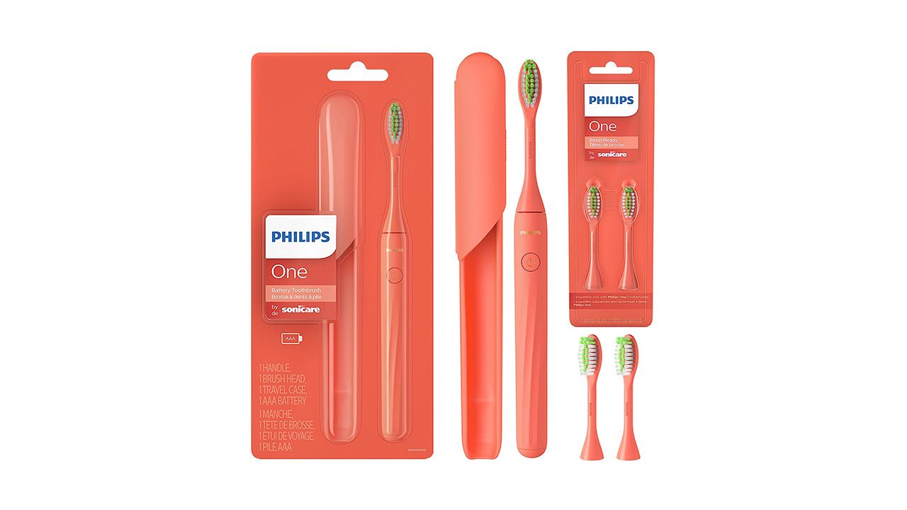 A photo of a bright orange Philips One toothbrush