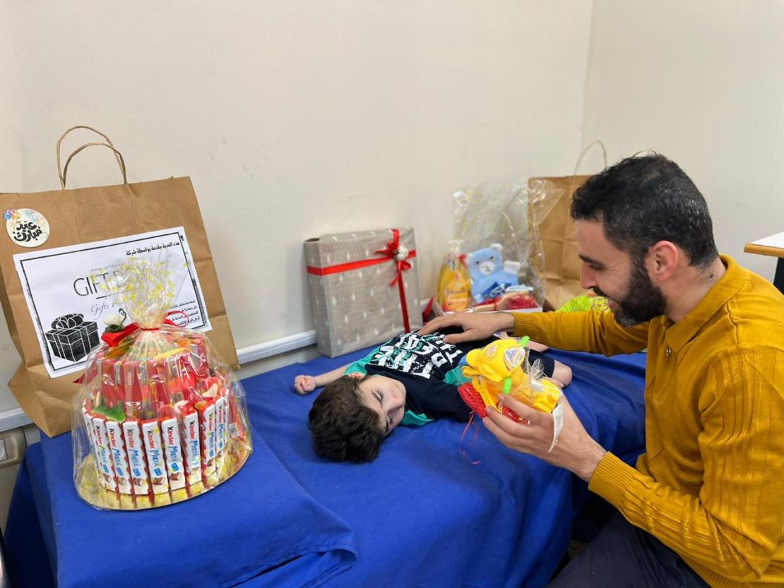 Hazem Saeed Al-Naizi (right) and Ayas (left) celebrate Eid at the orphanage in Gaza City, on May 12, 2022.