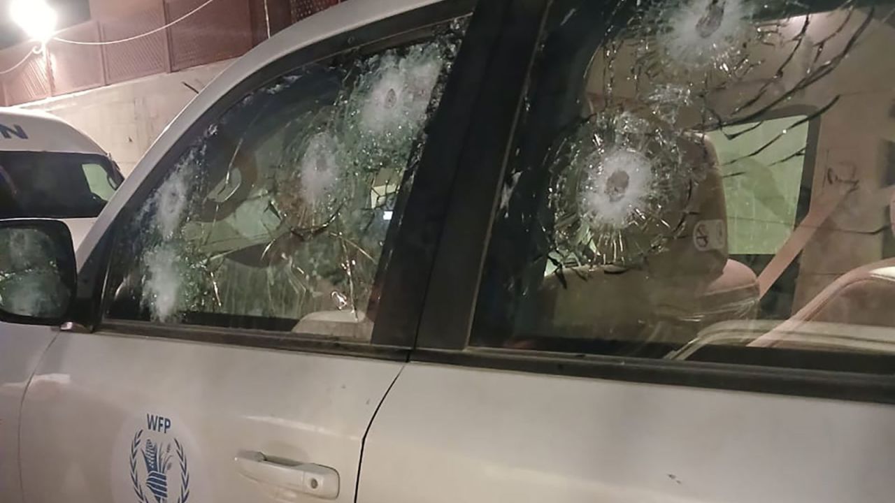 A photo released by World Food Program shows multiple bullet pock marks in the drivers’ side window; in total, at least ten bullets hit the vehicle, according to the agency.