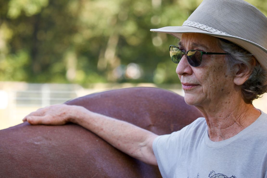 Stride Ahead founder Anne Preston participates in a horse therapy session. She founded the program in 2009.