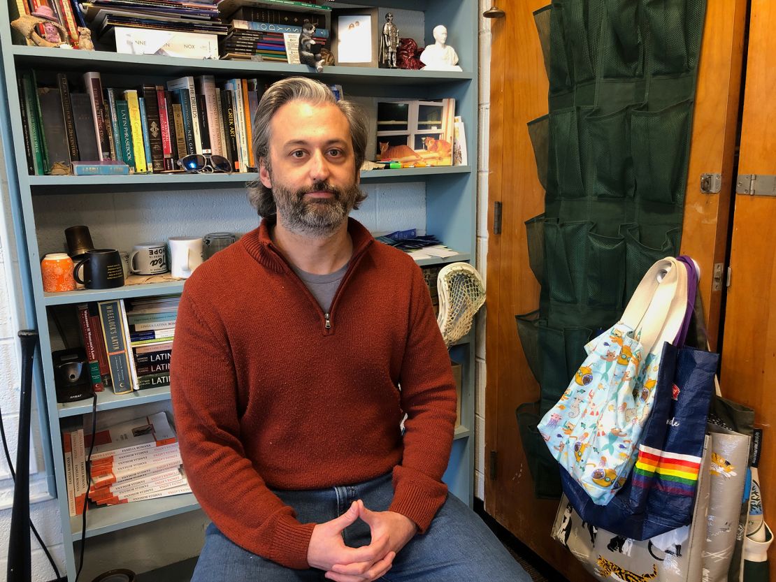 Joe Carroll poses for a portrait in his classroom on November 20. Carroll teaches both Latin and an elective class on healthy masculinity at Montpelier High School in Vermont.