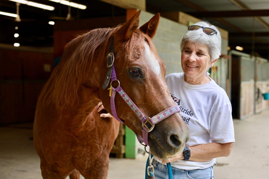 Certified equine specialist Pam Smith with her 38-year-old horse Justin. He has been a therapy horse for over a decade.