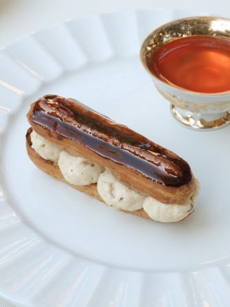 <strong>Unexpected flavors: </strong>Uğurtaş’s savory éclair has powdered shrimp shell within the pastry, is filled with a shrimp cream and accompanied by a cup of peach kombucha.