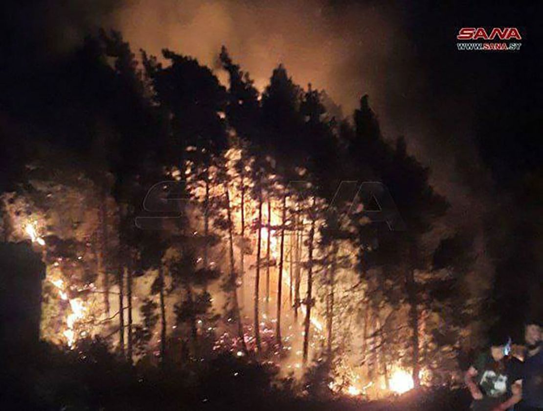 A photo released by Syrian state news agency SANA on Sunday, September 8, shows the Wadi al-Uyun highway in Masyaf, where a fire reportedly caused by Israeli airstrikes has broken out.