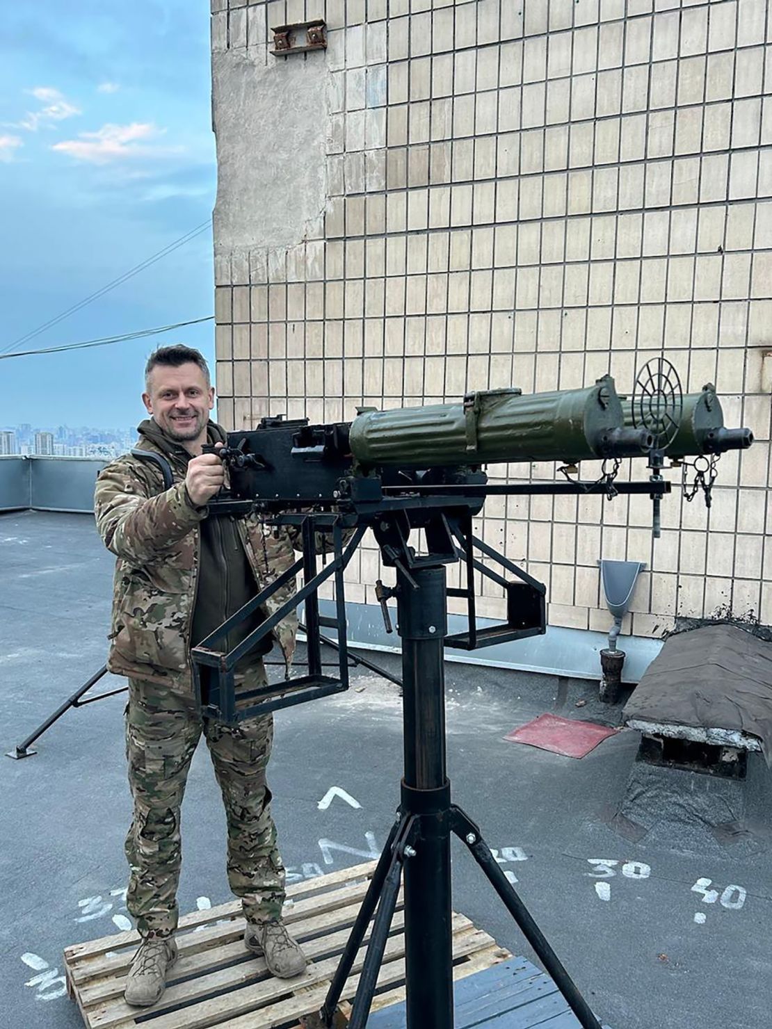 Yuriy Chumak at a position on Kyiv's rooftops equipped with machine guns to shoot down drones by civilians who volunteer to strengthen Kyiv's air defense.