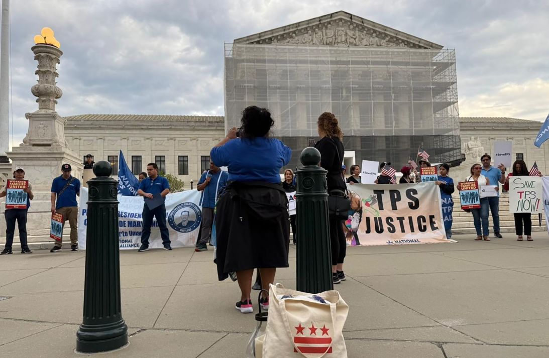 Soledad takes a moment to photograph demonstrators outside the Supreme Court on May 8 before leading the group in protest chants. 'There was some fear, but we still have to show up,' she says, 'always thinking of God, that he is with us.'