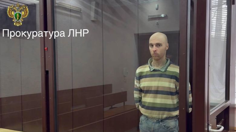Oscar Jenkins, an Australian man sentenced to 13 years in prison for fighting alongside Ukrainian forces against Russia, appears in a courtroom in Russian-controlled Luhansk, in eastern Ukraine, on Friday, May 16, 2025.