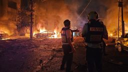Emergency personnel work the scene after a missile launched from Iran struck Haifa, Israel, on Sunday, June 15, 2025.