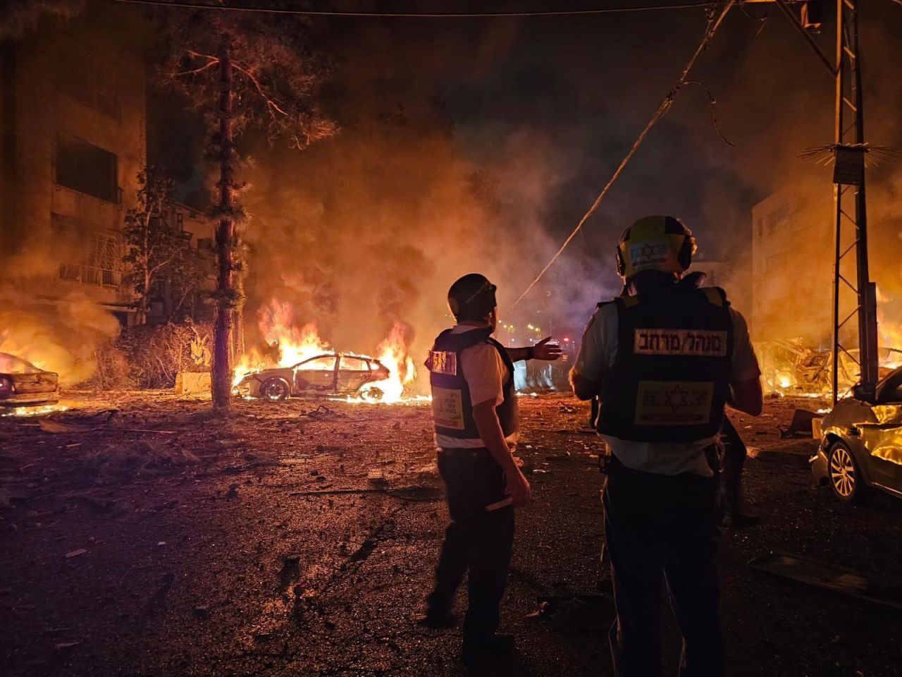 Emergency personnel work the scene after a missile launched from Iran struck Haifa, Israel, on Sunday.