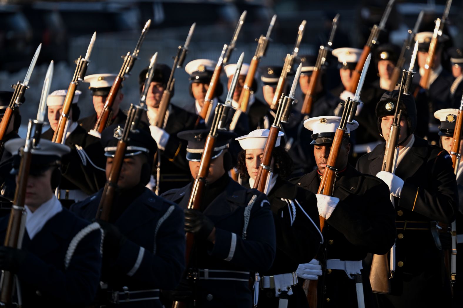 Members of the US military stand outside the Capitol as Carter's casket arrives on January 7.