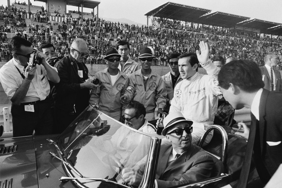 Jackie Stewart, who won the Indy 200 race, waves at the crowd before a lap of honor around the Fuji circuit in the pace car. Honda said meeting the racer, who was the same age as him, spurred his decision to pursue his calling, capturing the world’s fastest drivers on film.