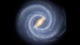 This artist concept illustrates the new view of the Milky Way. The galaxy two major arms can be seen attached to the ends of a thick central bar, while the two now-demoted minor arms are less distinct and located between the major arms. 