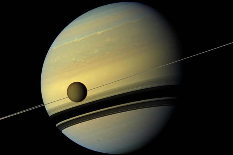 Saturn's rings and largest moon might be the result of a collision