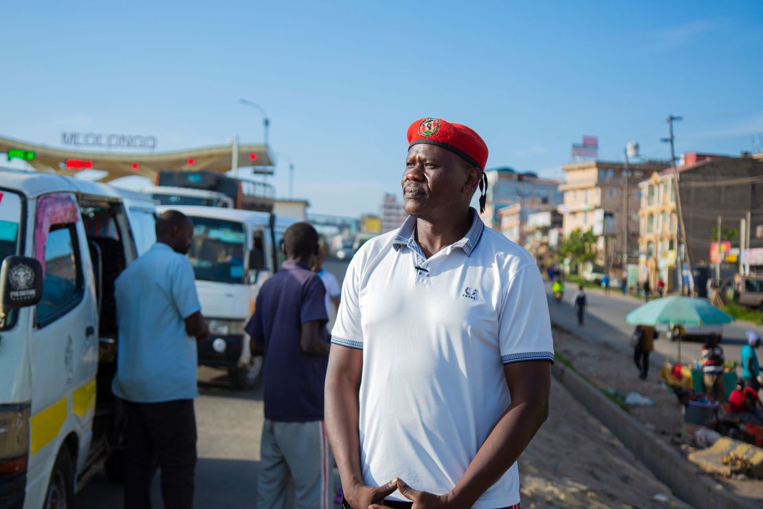 Activist Bob Njagi at the bus stop where he says he was abducted in August.